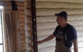 How to level walls in a wooden house with pox boards or plasterboard How to level a wall made of logs